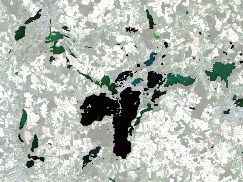 The image was captured by Sentinel-2B on 17 August 2020 showing lakes located in Northern Germany. Each has different water colours ranging from almost black to light green. The colour of water is determined by the absorption and scattering processes of water constituents. Green colours are caused by different amounts of microalgae, sometimes in combination with minerals or suspended sediments.